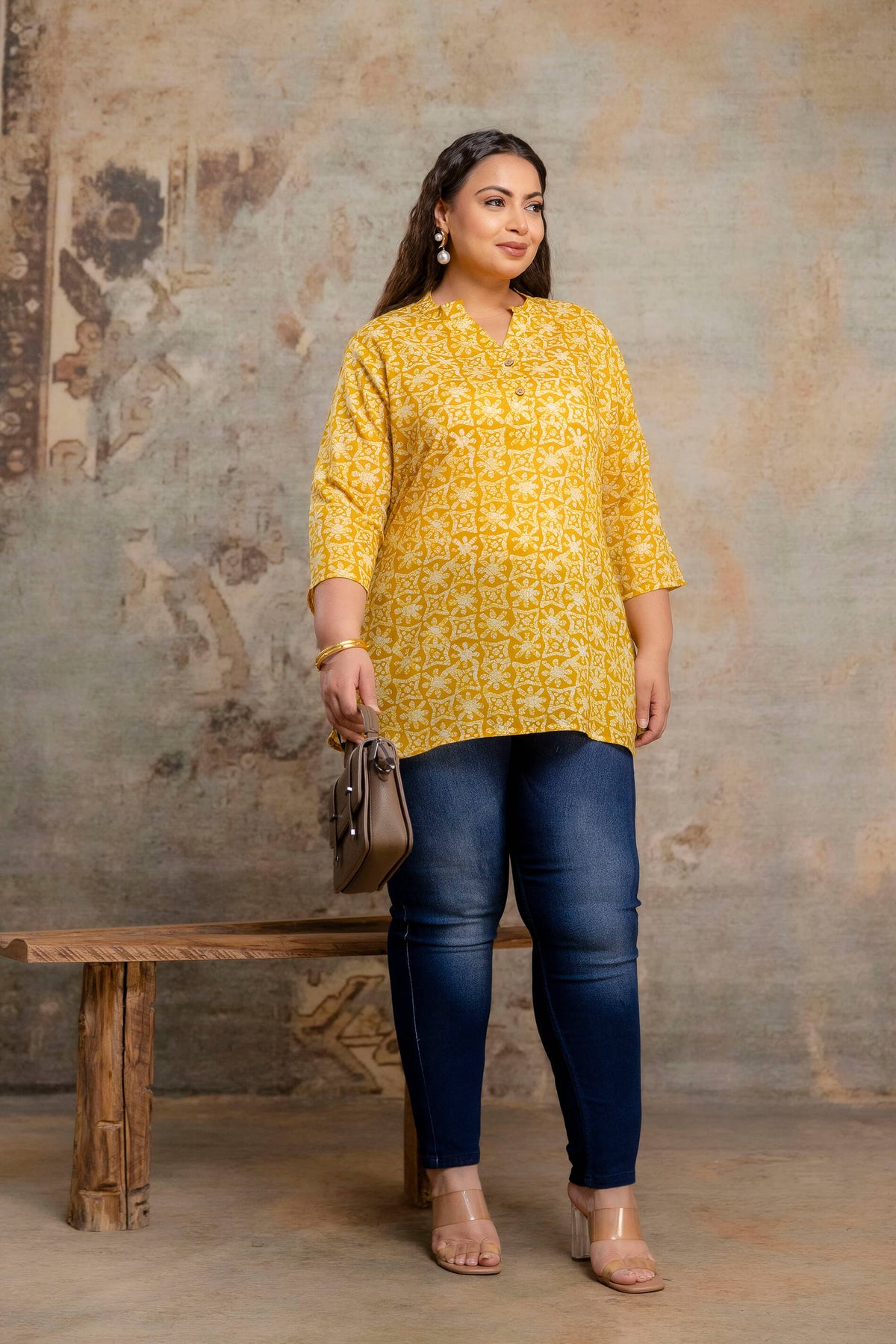 Front pose of plus size yellow printed cotton short kurti tunic for women, soft cotton daily wear