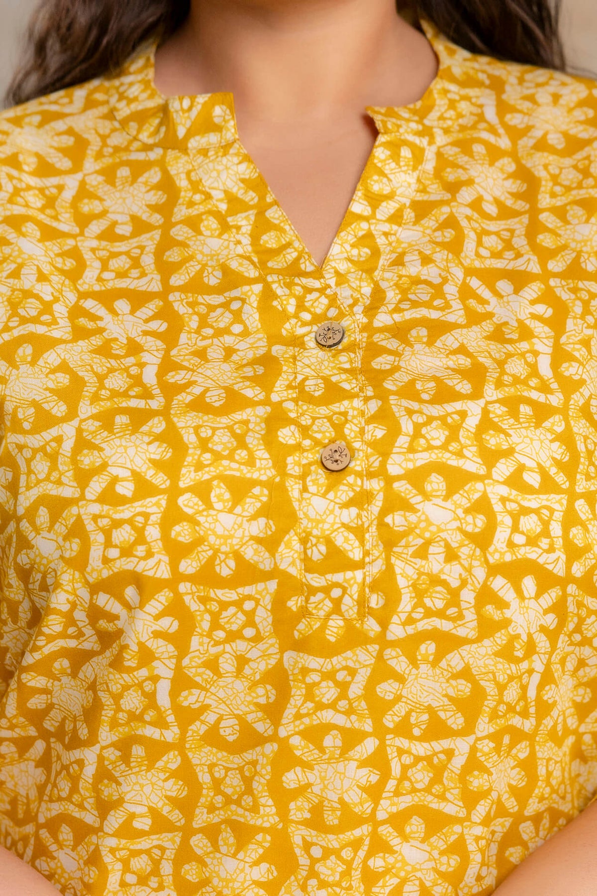 Lifestyle image of plus size yellow printed cotton short kurti tunic for fat and curvy women