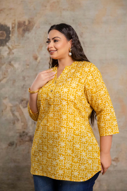 Side view of yellow printed cotton short kurti for fat women, relaxed fit big size kurti