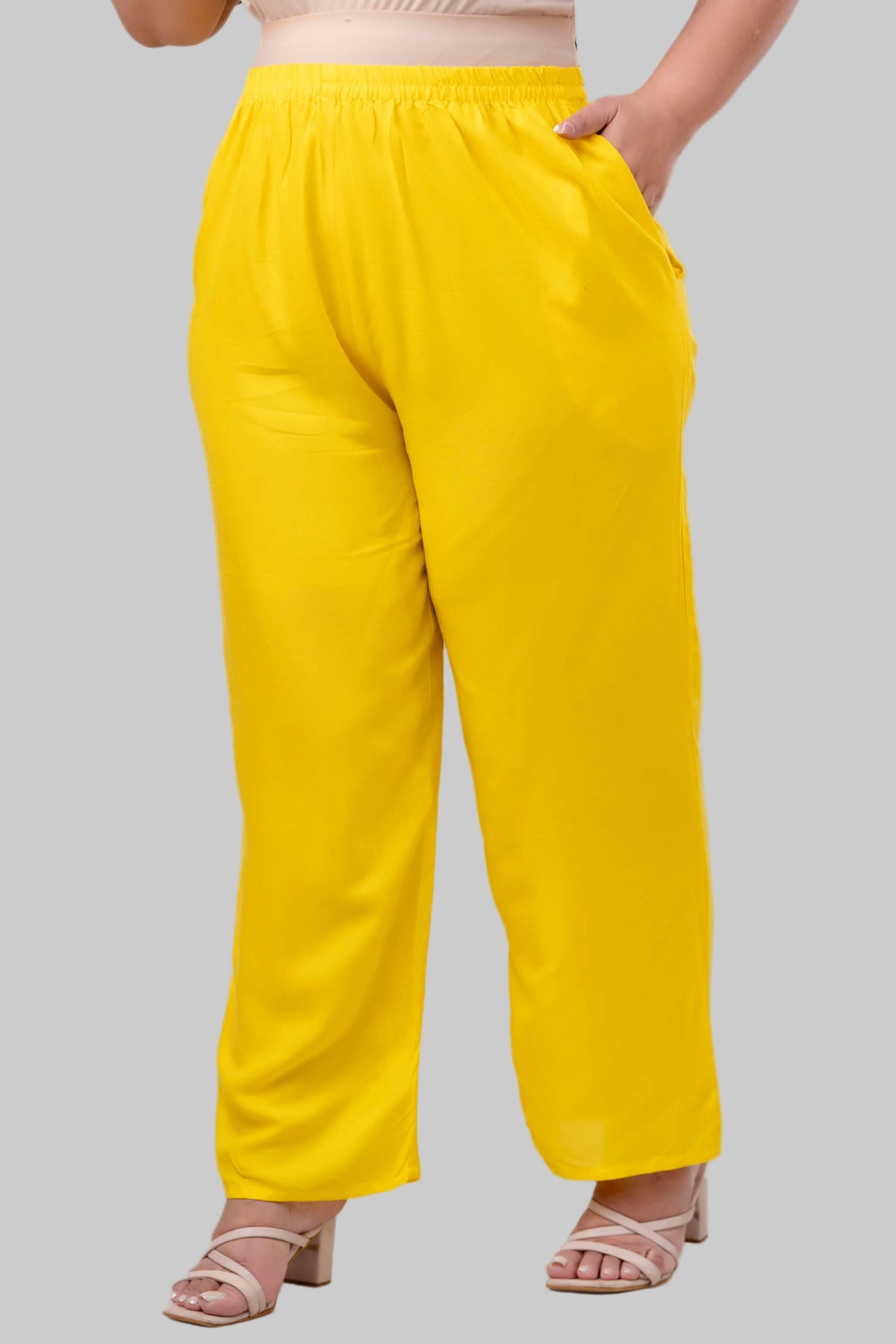 Front view of plus size yellow rayon palazzo pants with elastic waistband and soft rayon fabric – Curvisha big size