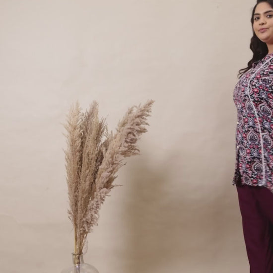 Elegant purple flowy palazzo trousers for plus size women, featuring a smooth drape and versatile fit.