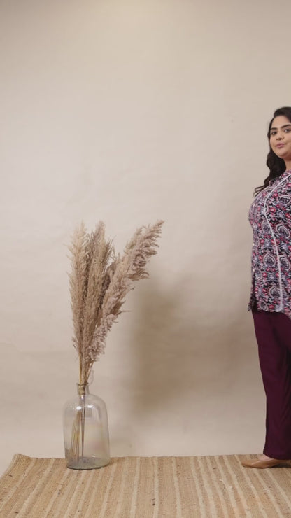 Elegant purple flowy palazzo trousers for plus size women, featuring a smooth drape and versatile fit.
