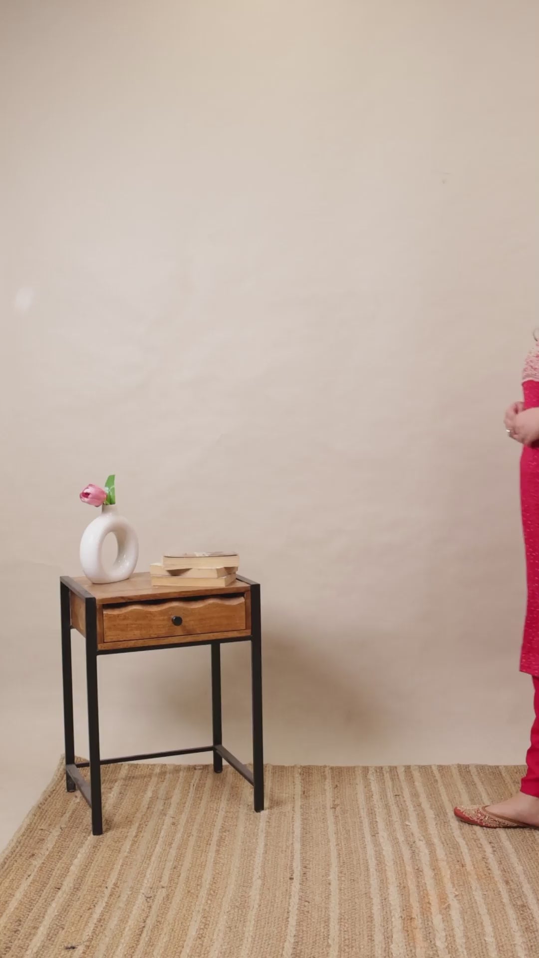 Plus size woman wearing a vibrant pink Kurti with intricate white embroidery on the neckline, paired with matching straight-fit pants.