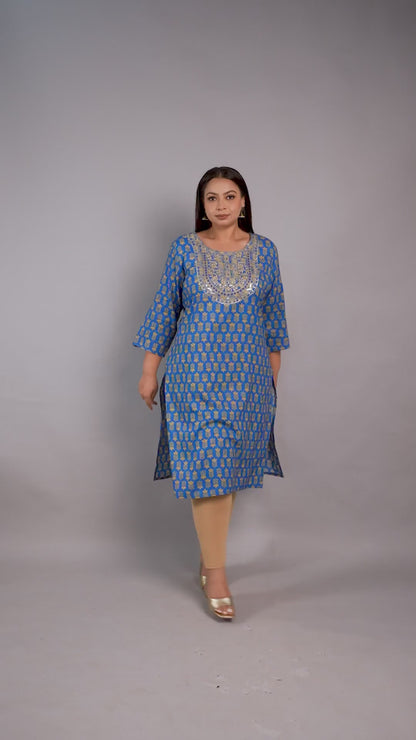 Curvisha plus-size blue ethnic kurta featuring gold leaf patterns and a heavily sequined embroidered neckline, styled with beige leggings.