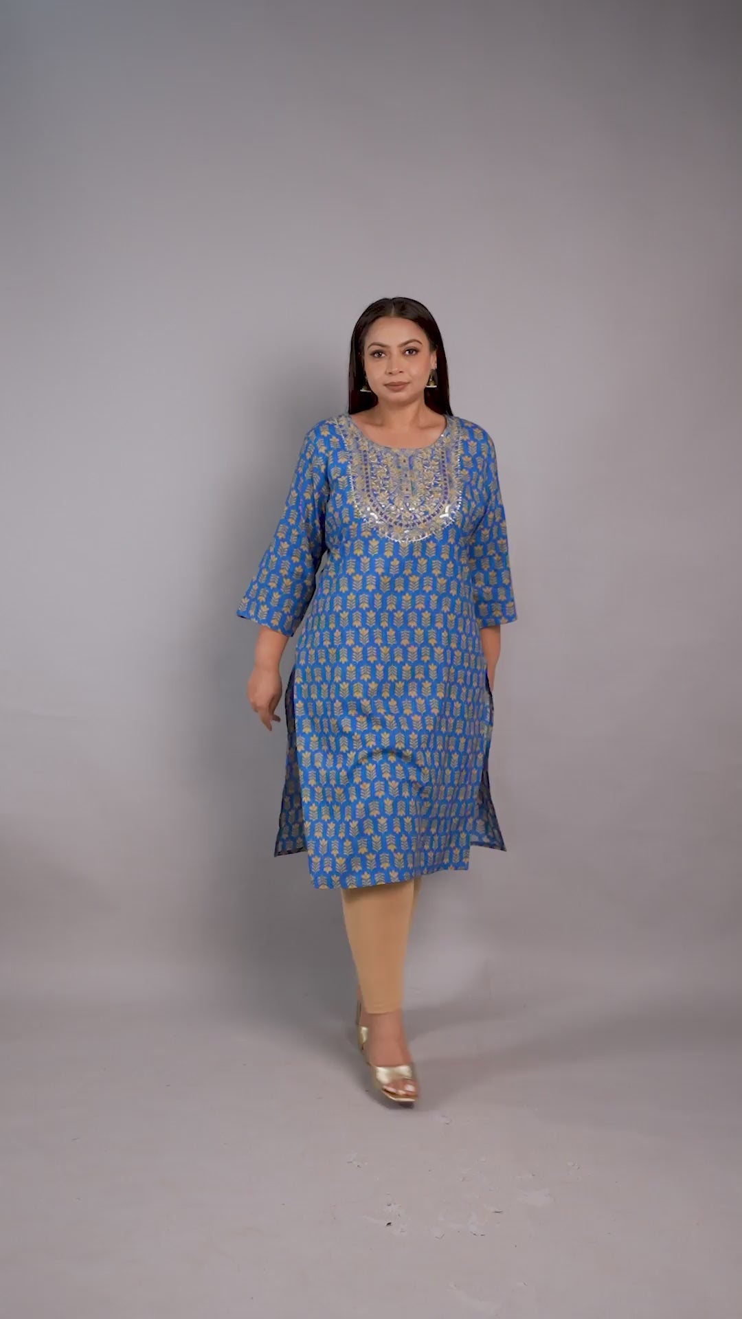 Curvisha plus-size blue ethnic kurta featuring gold leaf patterns and a heavily sequined embroidered neckline, styled with beige leggings.