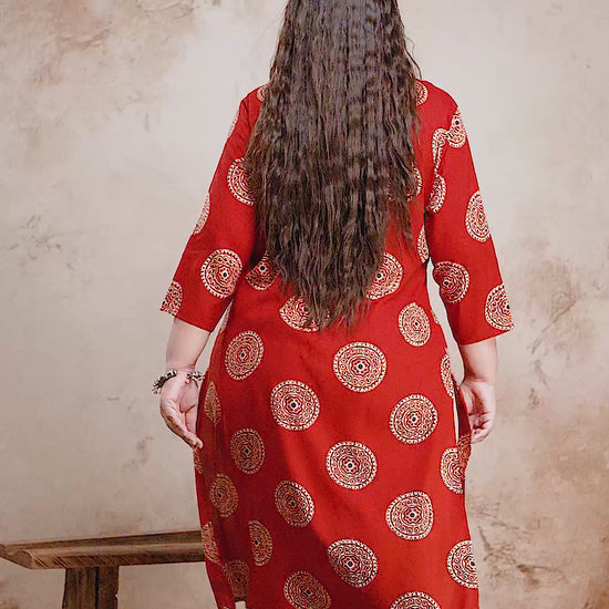 Flowy plus size red floral kurta with side slits, model walking shot showing the airy and comfortable fit for fat women.