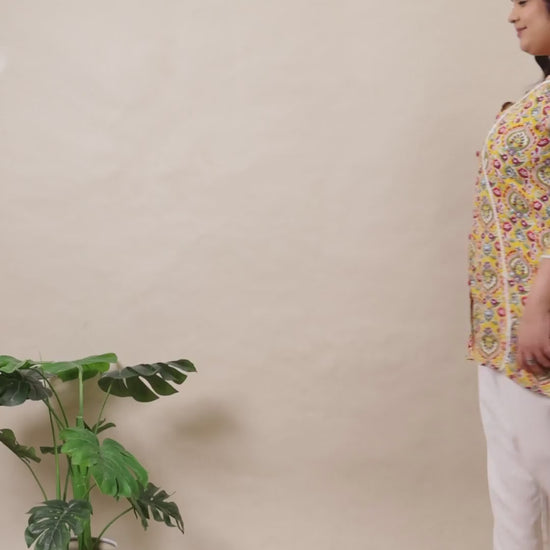 Curvisha plus size yellow paisley Angrakha kurti with adjustable waist ties for a comfortable ethnic fit.
