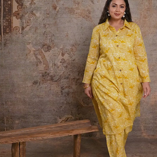 Full view of Curvisha plus size yellow floral kurta and pant set, showcasing a complete ethnic look for curvy body types.