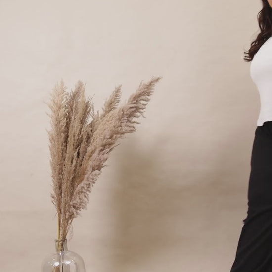 Curvisha black ribbed wide-leg lounge pants for plus-size women, featuring deep side pockets and a comfortable high-waisted fit.
