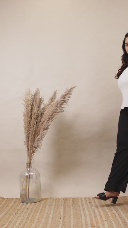 Curvisha black ribbed wide-leg lounge pants for plus-size women, featuring deep side pockets and a comfortable high-waisted fit.