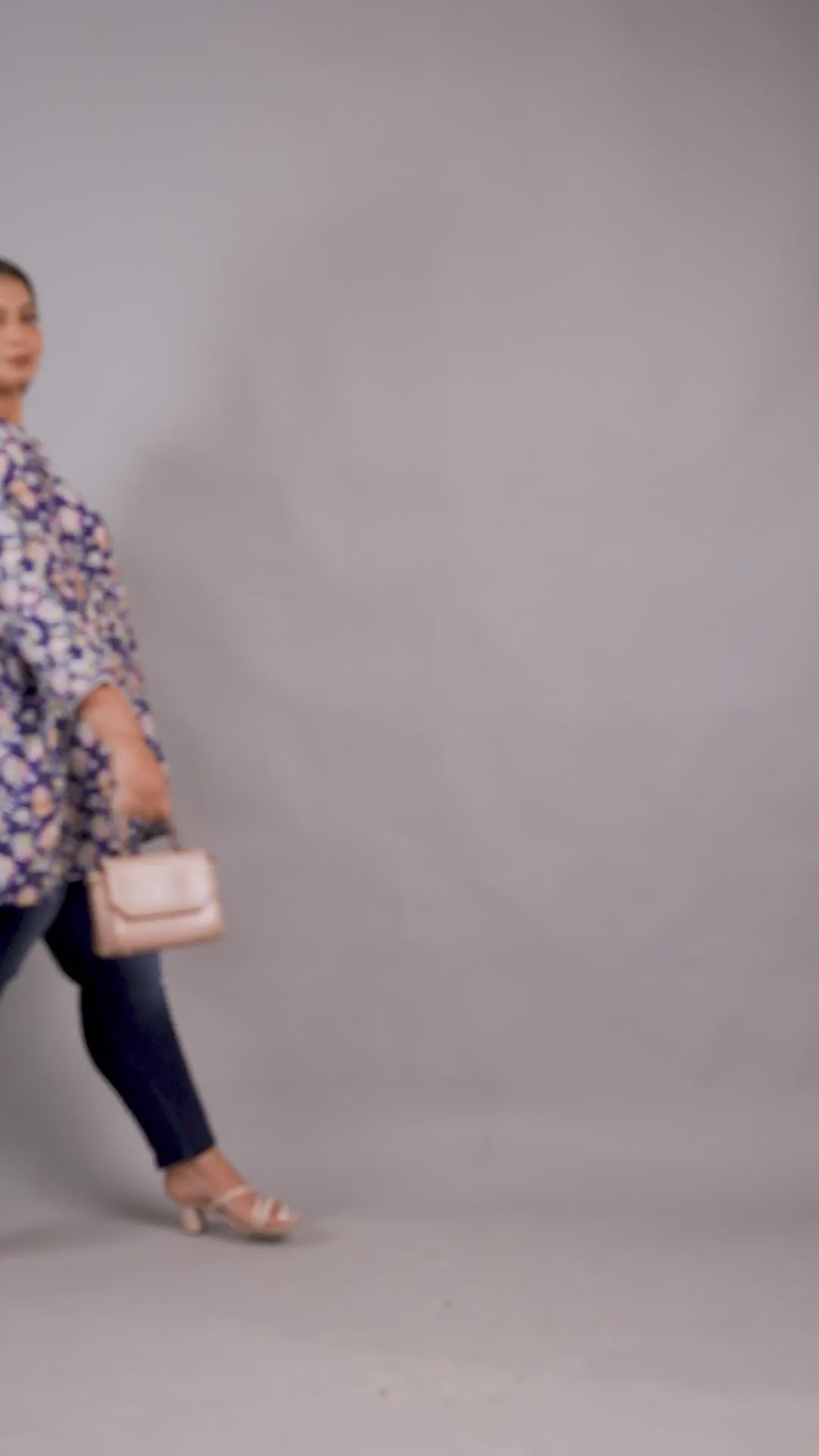 Stylish plus size blue floral tiered tunic top from Curvisha, paired with denim for a modern look.
