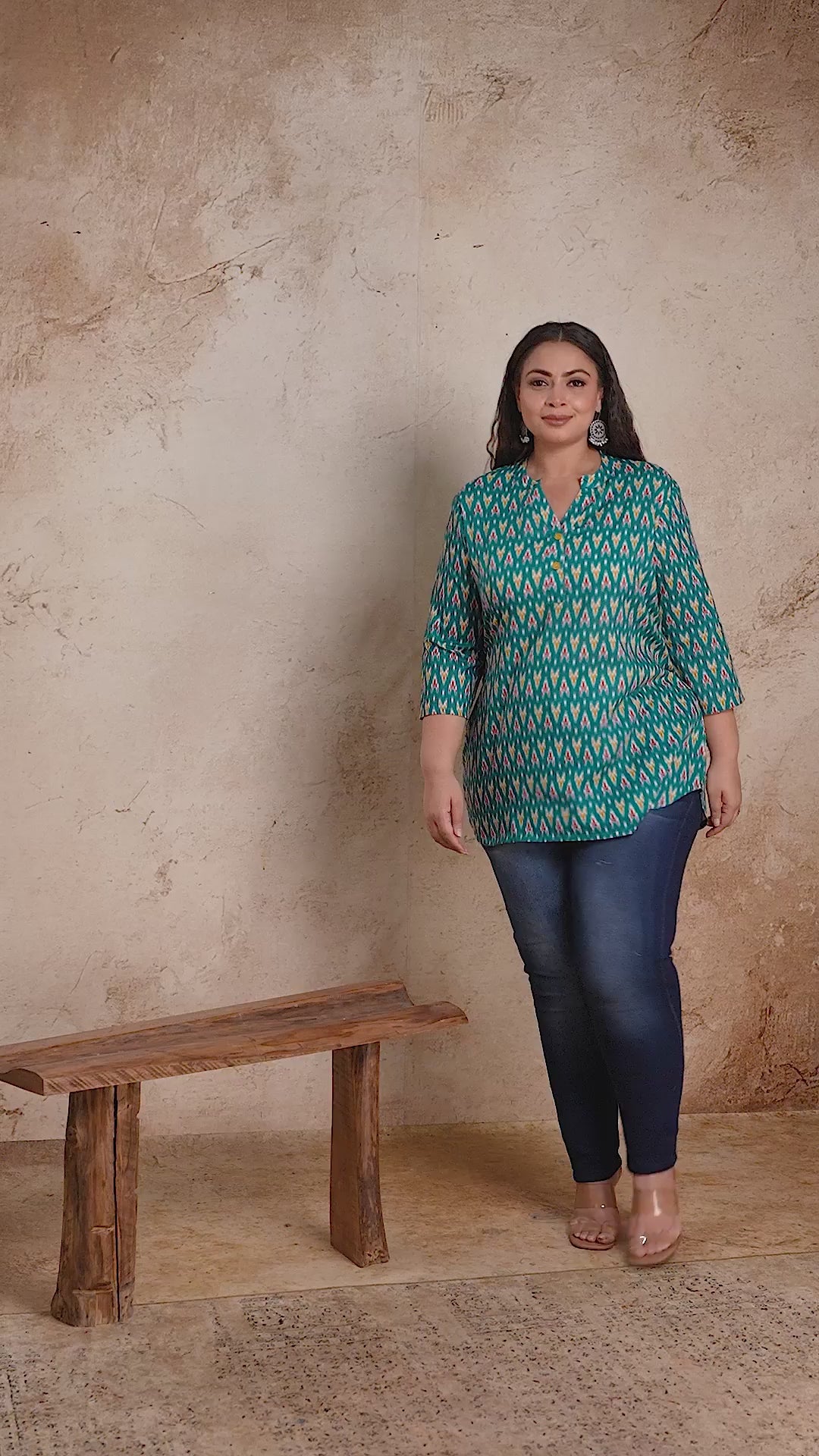 Curvisha plus size teal green Ikat print short cotton kurti top, styled with jeans for a stylish and comfortable casual outfit.