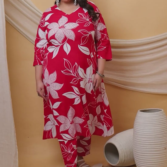 Plus-size co-ord set in crimson red with oversized white floral patterns, ideal for casual outings or festive wear.