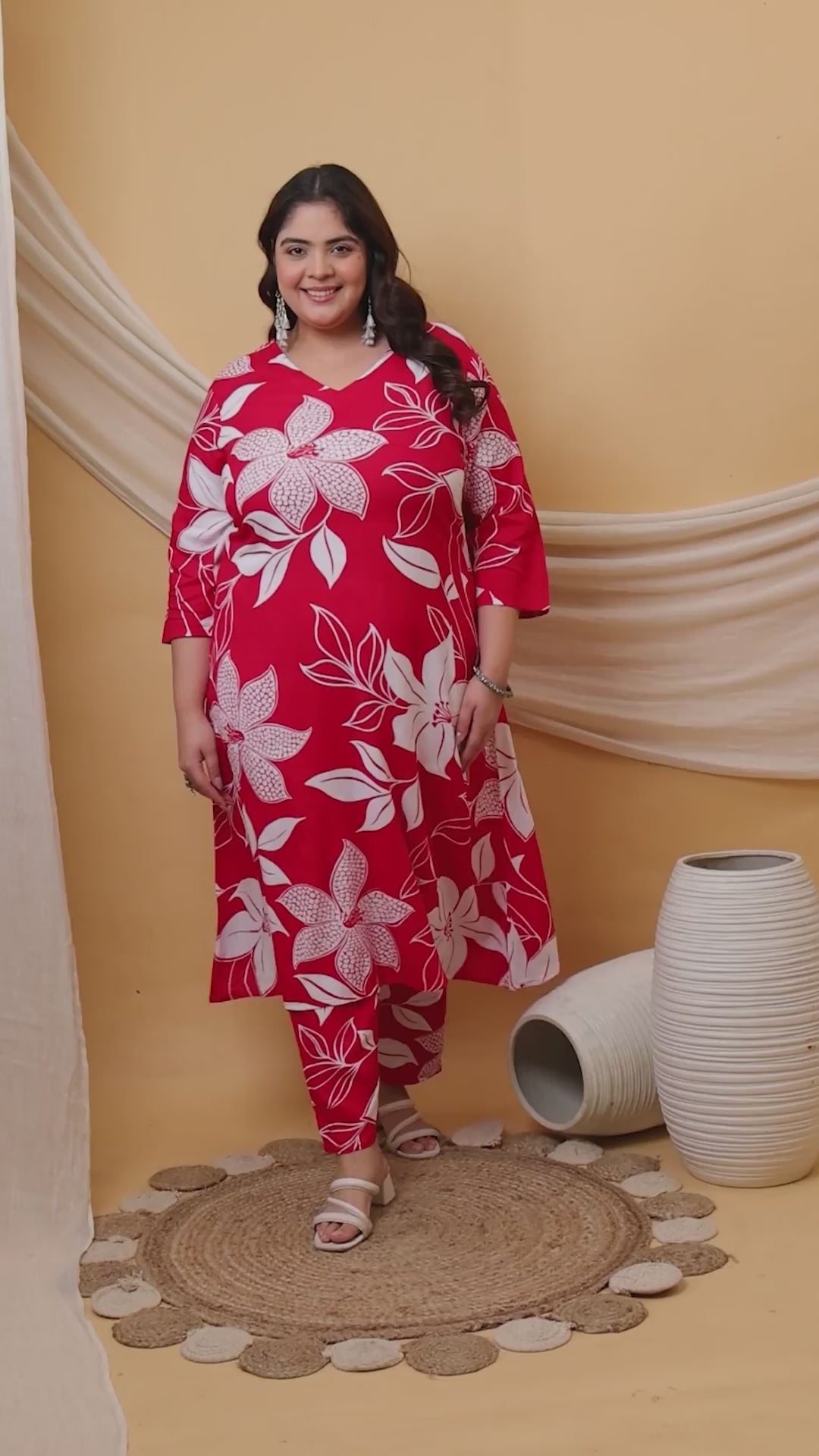 Plus-size co-ord set in crimson red with oversized white floral patterns, ideal for casual outings or festive wear.