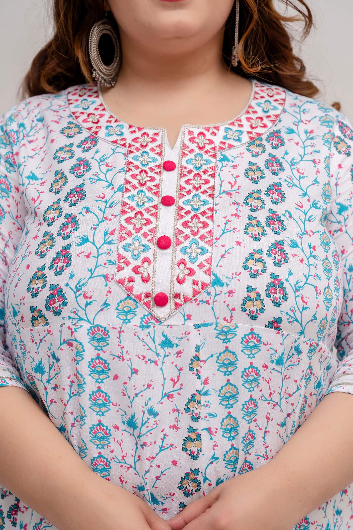 Neckline design detail on white turquoise floral gown for fat women